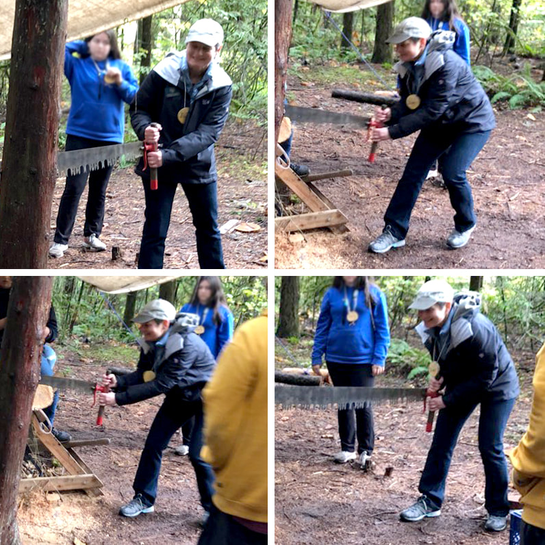 Senator Elizabeth Steiner learning to use the crosscut saw at Outdoor School.