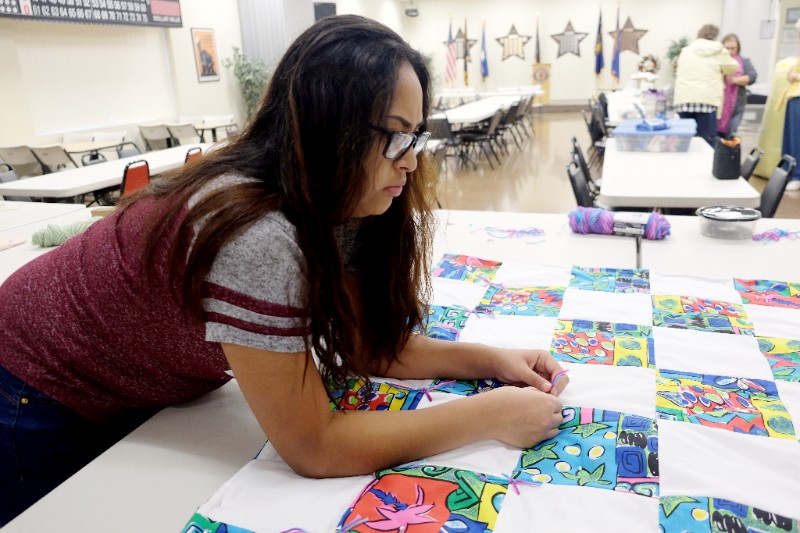 Student Working on Quilt