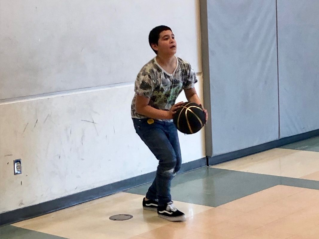 Arata Creek student playing basketball