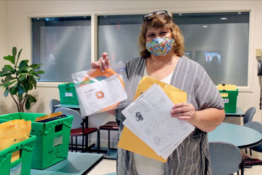 Mary Smith, the Administrative Assistant at Wheatley, assembles student packets to be sent from the Multnomah Education Service District building, Nov. 6, 2020.