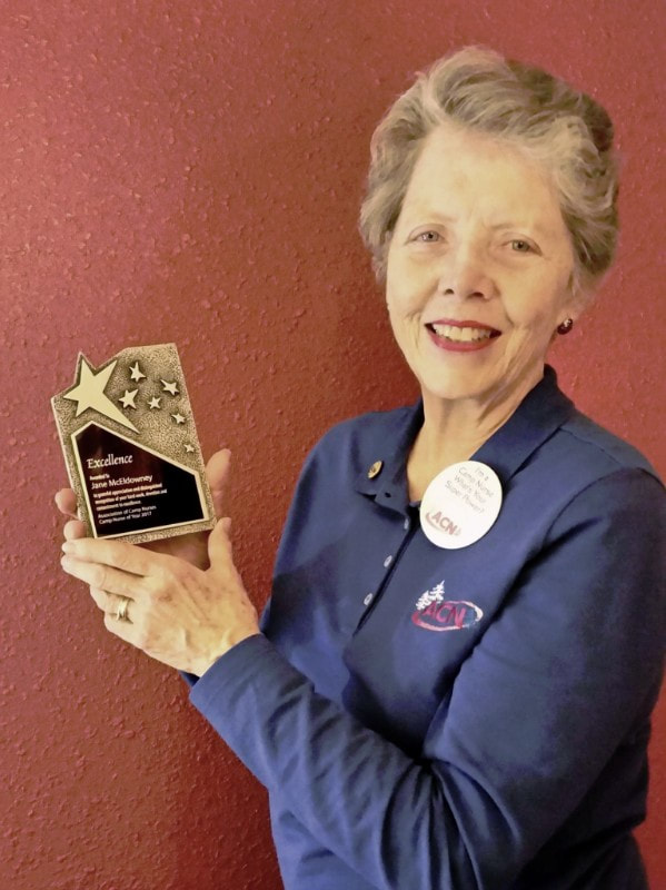Jane McEldowney with her award