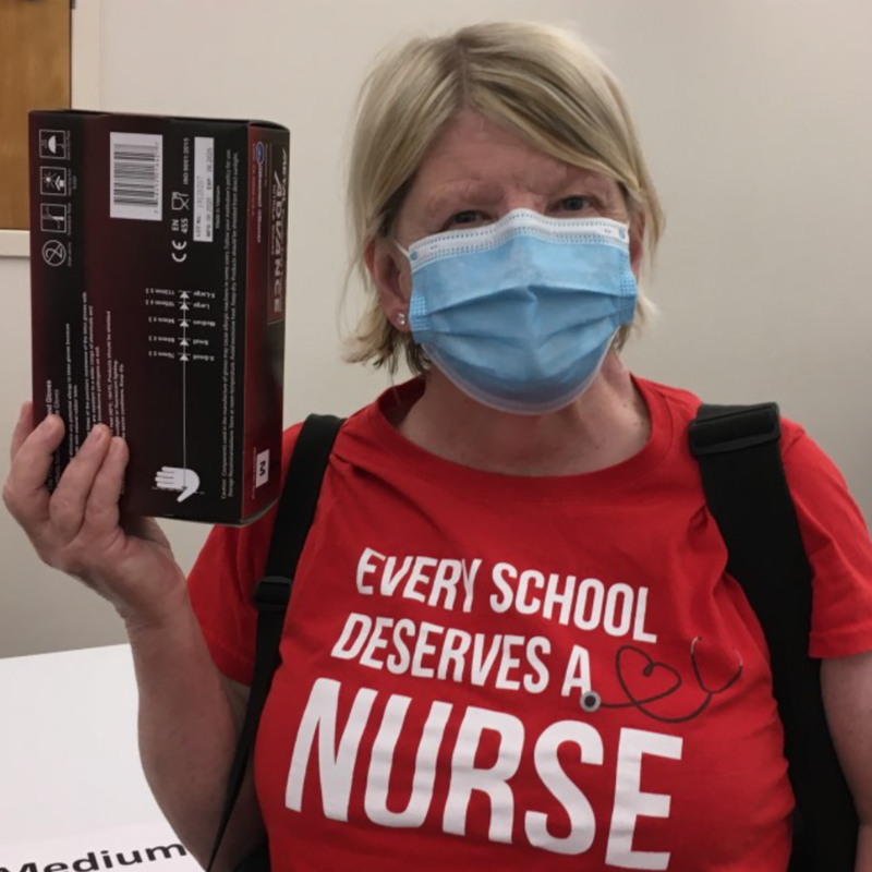 Nicky Zimmerman, a School Health Services Nurse, picks up personal protective equipment from the Multnomah Education Service District building, early Sept. 2020.